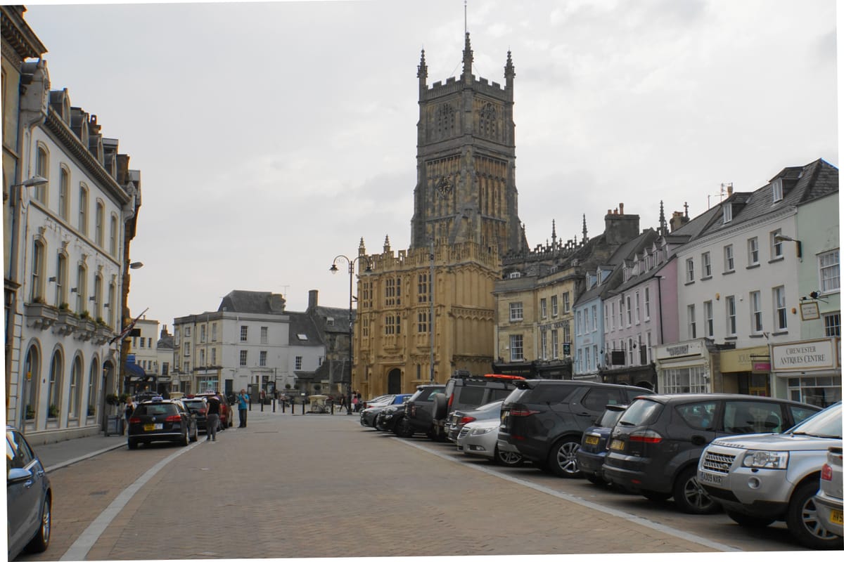 The market place at Cirencester, with the tower of St John the Baptist above the street