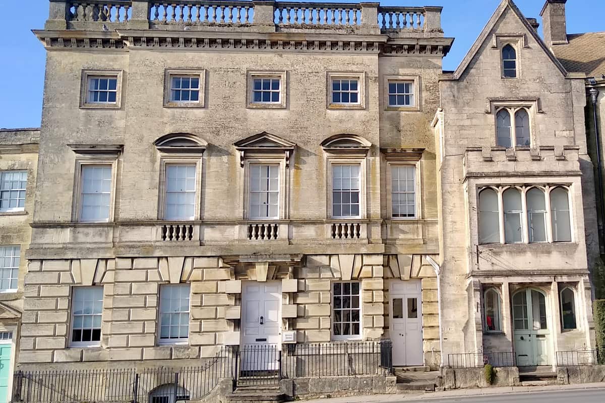 Pale limestone houses on New Street in Painswick